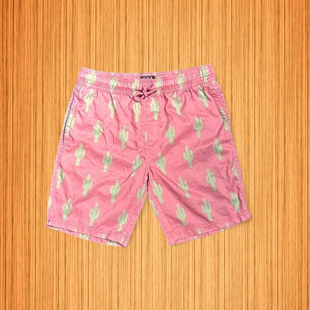 Pink swim trunks featuring an all-over cactus print from CYA